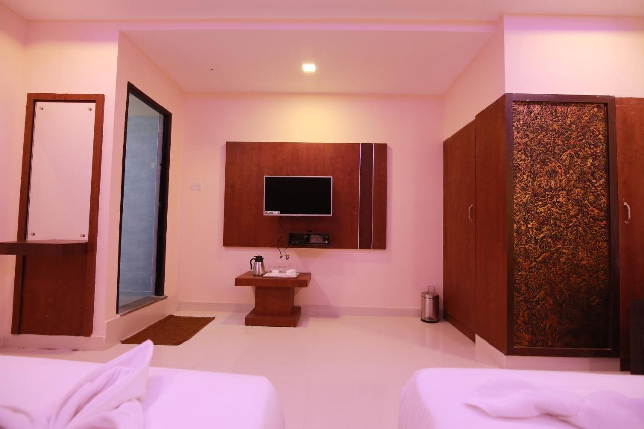 Hotel Apple Suites Bangalore Bagian luar foto